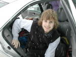 David exiting car in snow